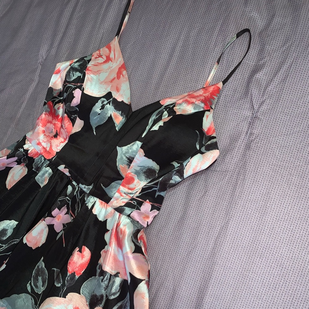 This is a formal floral dress worn once